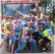 team healthy living at a fire truck pull