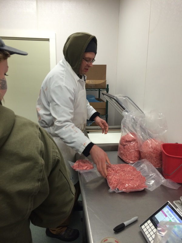 Vacuum sealing meat for packaging. Sealer